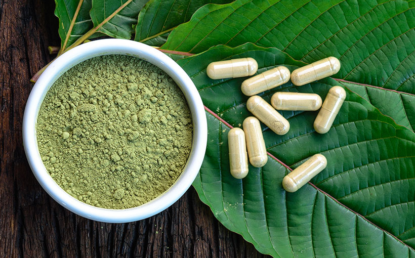 Kratom leaf with capsules and powder